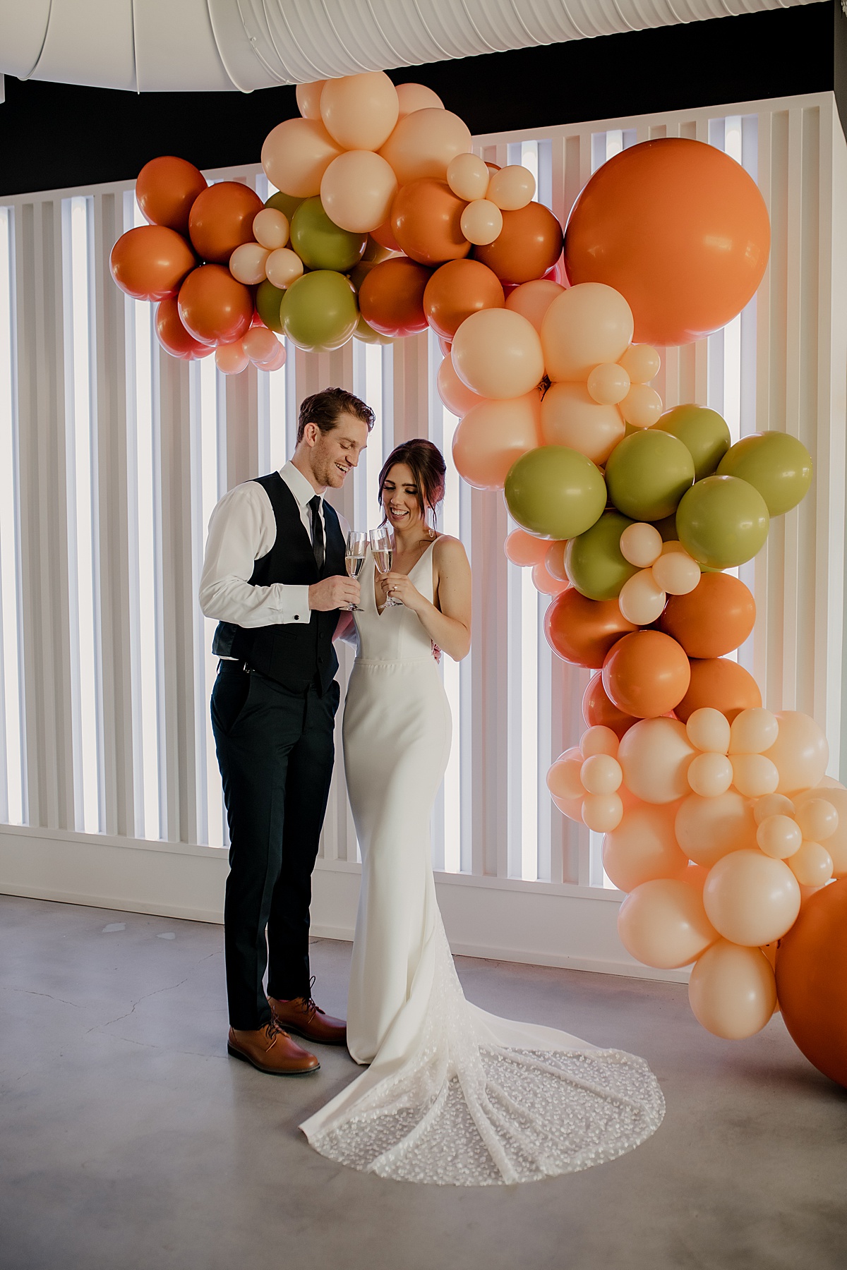 Colorful artistic wedding balloon arch at The Maverick KC.